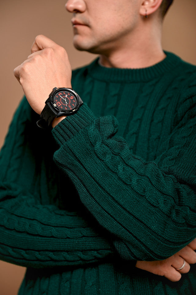 Green cable-knit sweater